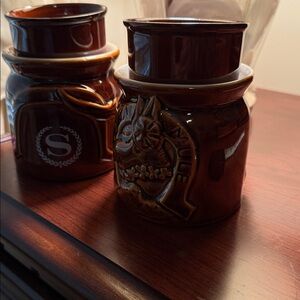 Pair of Molajai Mule mugs with tea light holders from Sheraton. 5” x 4”